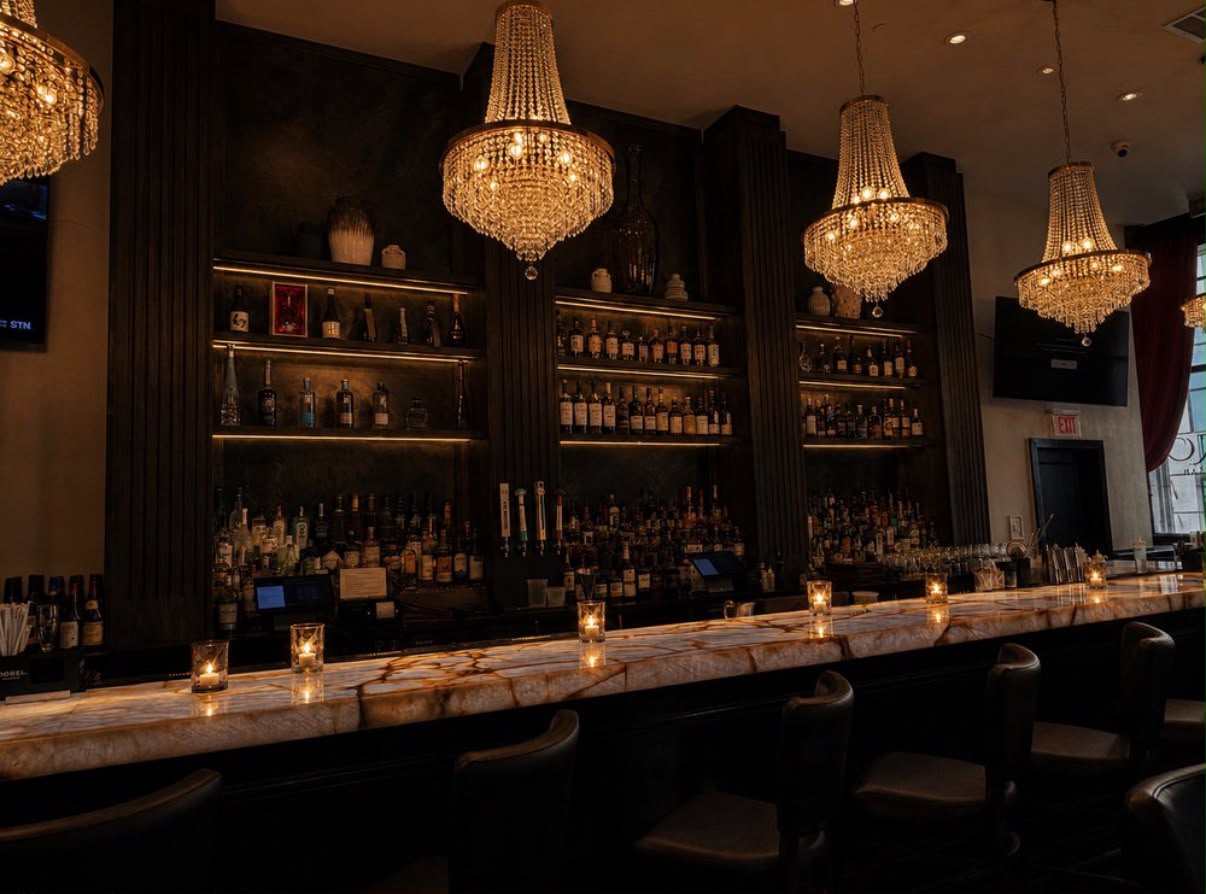 The backlit bar at Yamasaki with candlelit onyx counter
