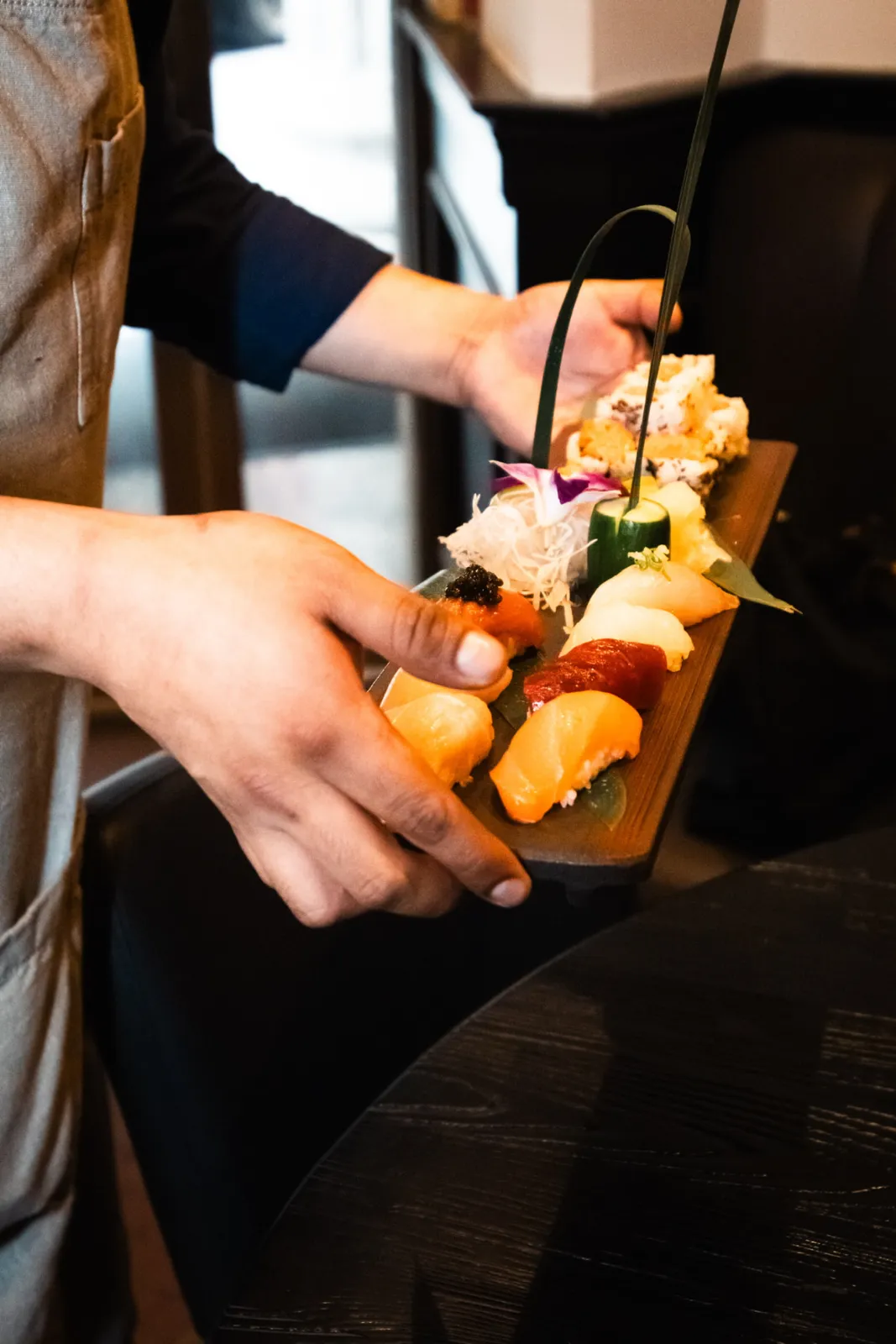 A nigiri platter carried to the table